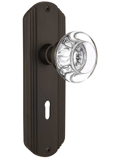 Streamline Moderne Mortise Lock Set with Round Crystal Glass Knobs with Keyhole in Oil-Rubbed Bronze.